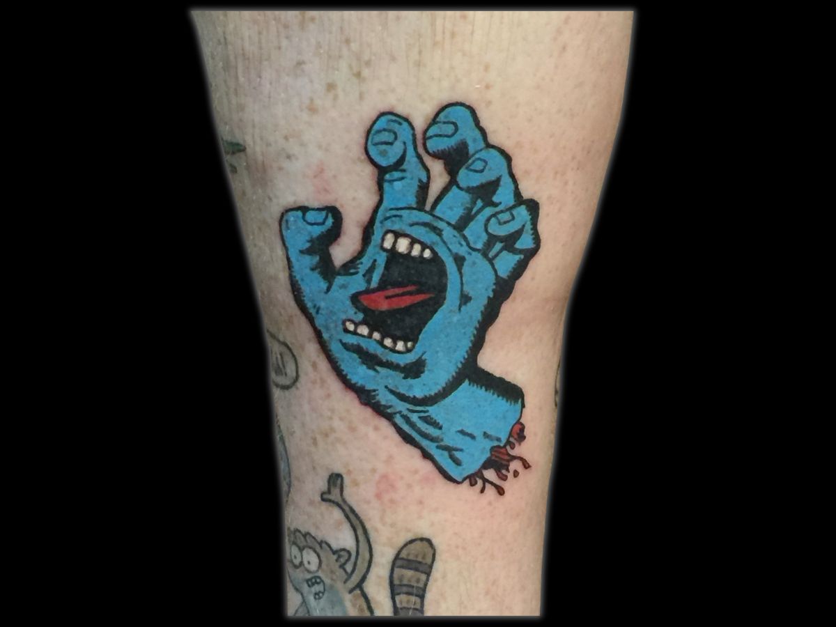 Screaming hand tattoo by Byron at Earth's Edge Tattoo & Piercing in Winston-Salem