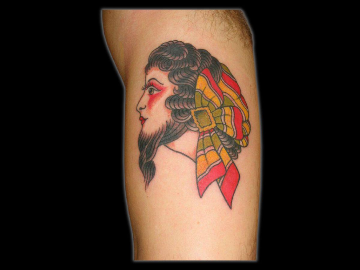 Traditional bearded lady tattoo by Greg at Earth’s Edge in Winston‑Salem, NC.