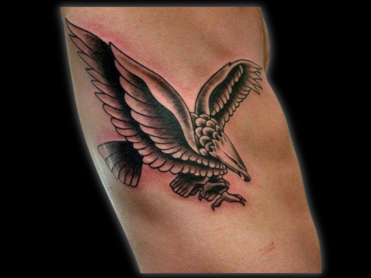 Traditional eagle tattoo by Greg at Earth’s Edge in Winston‑Salem, NC.