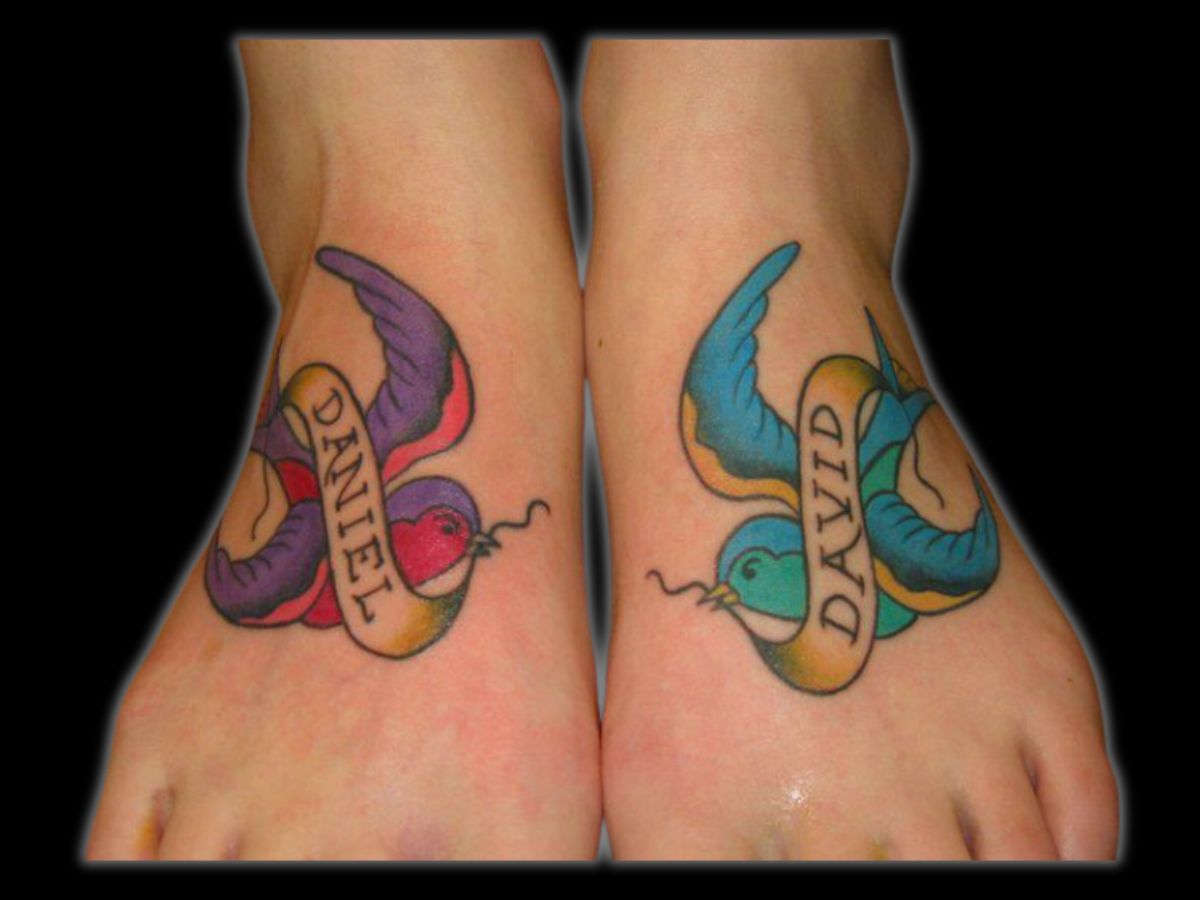 Traditional swallow with name ribbon by Greg — Earth’s Edge Tattoo & Piercing.