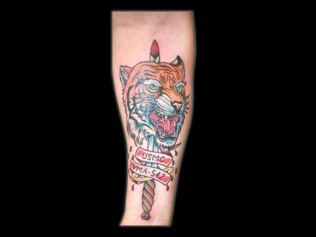USMC tiger and dagger tattoo by Greg at Earth’s Edge Tattoo & Piercing, Winston‑Salem NC.