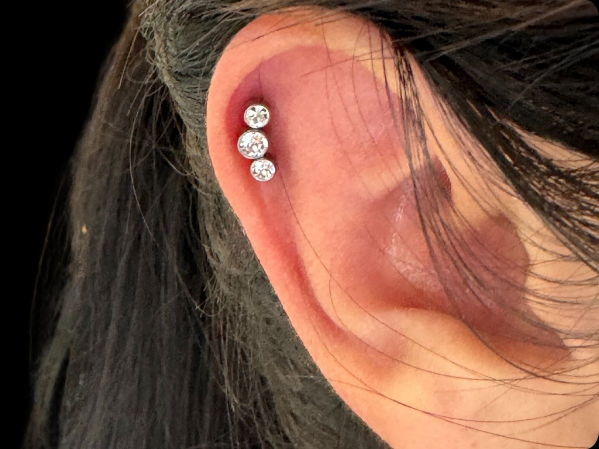 3 stone helix ear piercing by Josh at Earth’s Edge Tattoo & Piercing in Winston‑Salem, NC