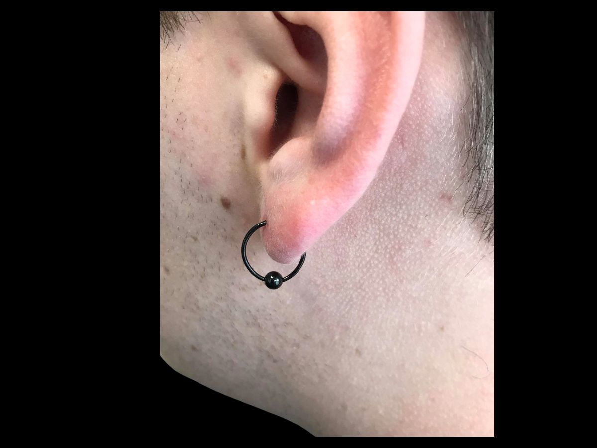 Ear lobe piercing by Josh at Earth’s Edge Tattoo & Piercing