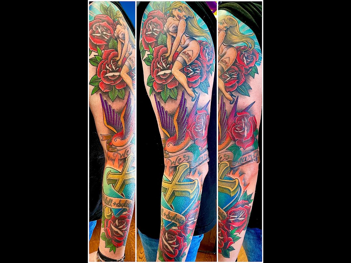 Pin-up and rose sleeve tattoo by Nico