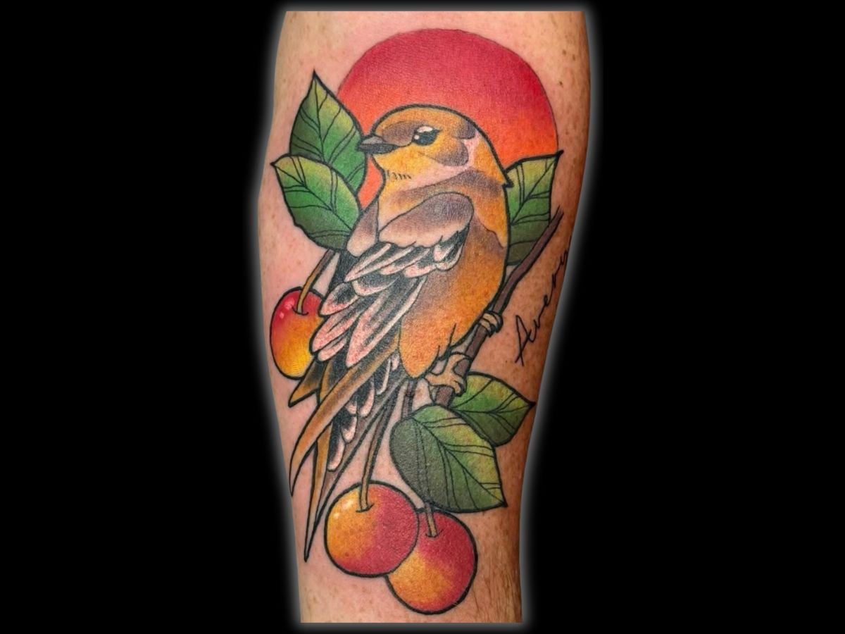Traditional bird and cherries tattoo by Robert at Earth’s Edge Tattoo & Piercing in Winston-Salem, NC